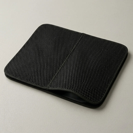 Kattenbakmat tegen grind op de vloer